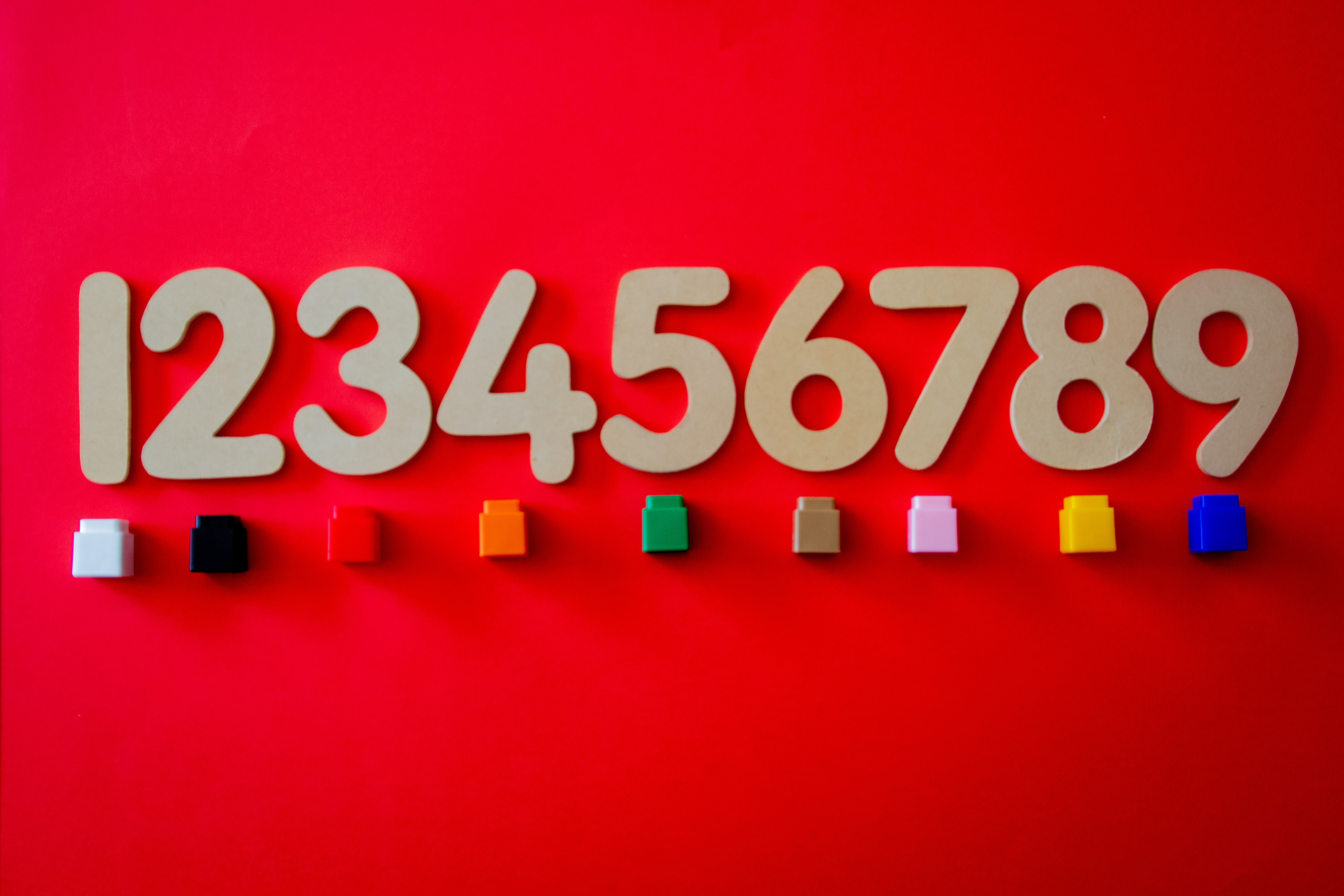 Wooden numbers on a red background